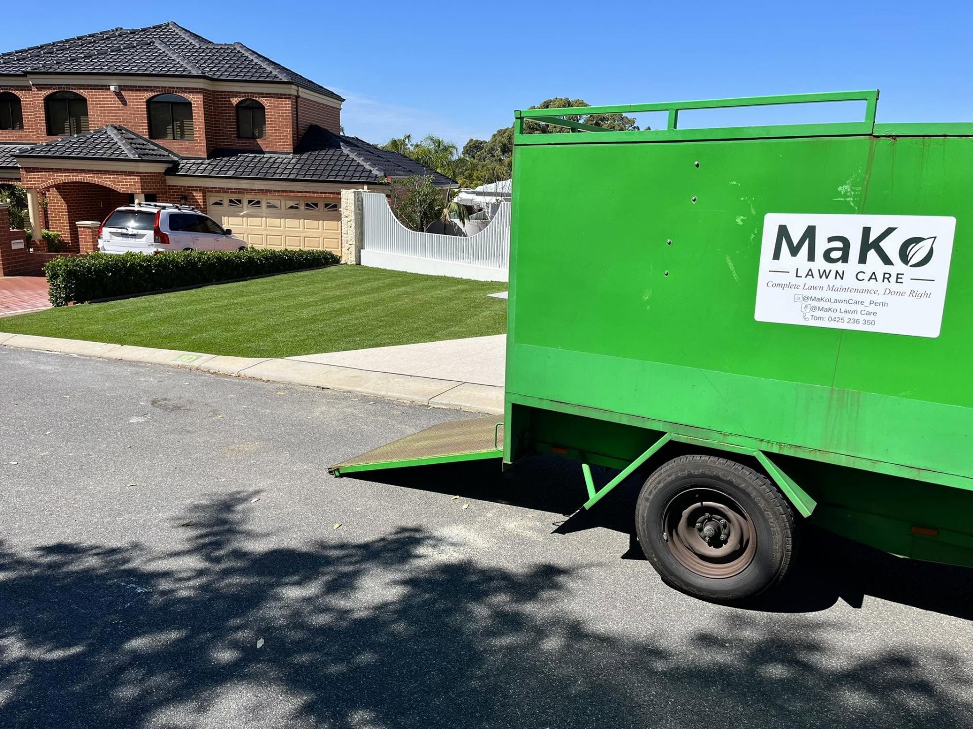 Branded MaKo Lawn Care trailer at a Joondalup property